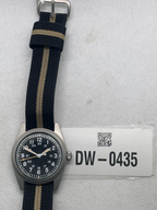 Pre-owned Rdunae field watch with a black 12- and 24-hour dial and black fabric strap with a tan stripe, beside tag DW-0435.