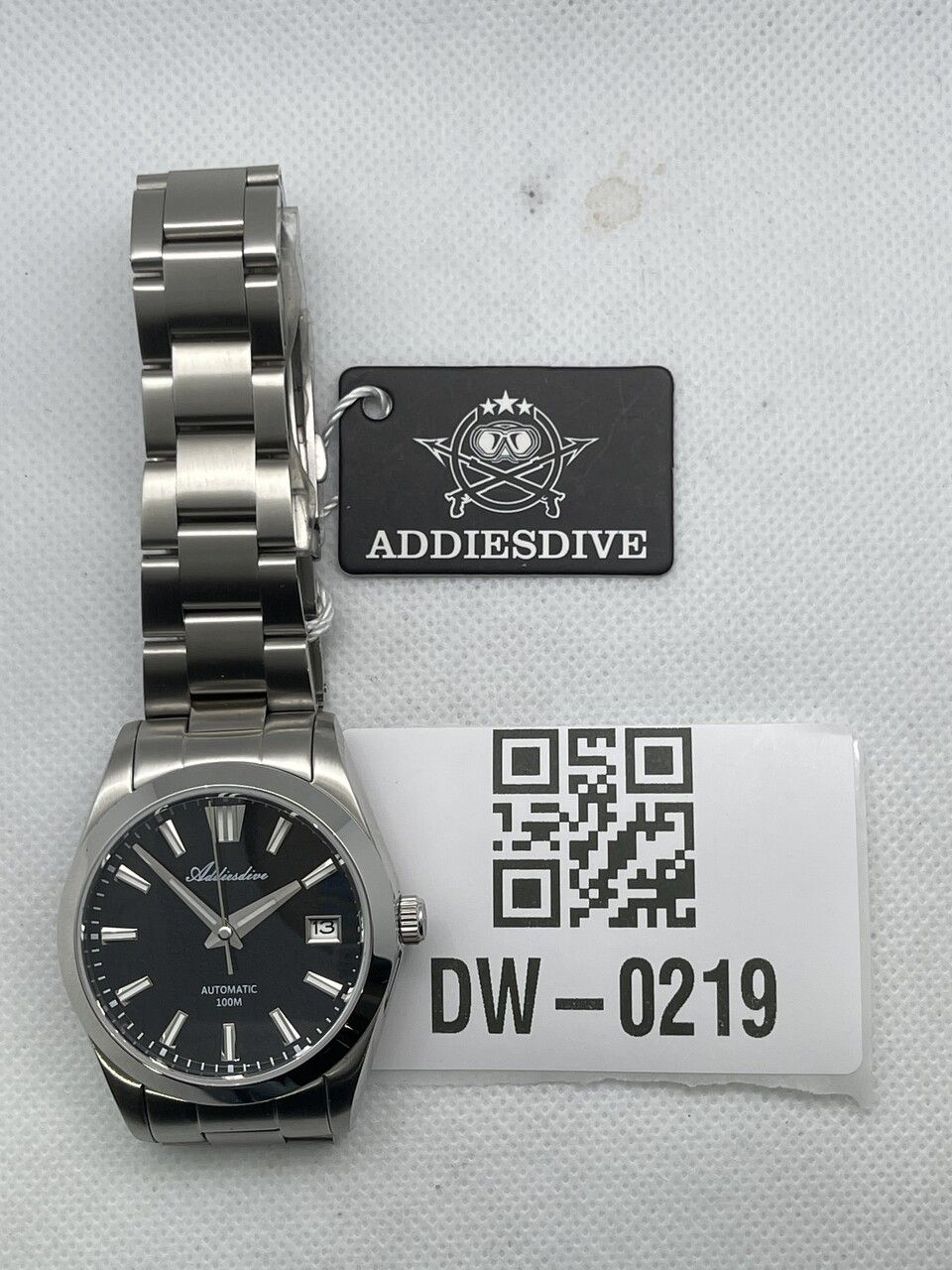 Pre-owned Addiesdive watch with a black dial, date window and stainless steel bracelet, photographed with tag DW-0219.