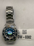 Pre-owned Cronos watch with a blue dial, black dive bezel and silver-tone bracelet, photographed beside tag DW-0382.