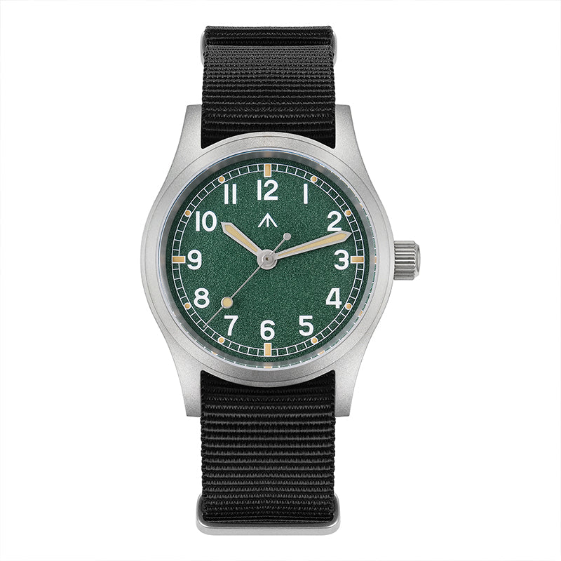 Front view of a Militado ML12 field watch with green dial, silver-tone case, and black nylon strap on white
