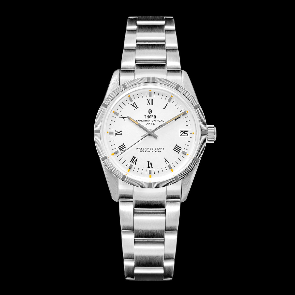 Front view of a Thorn Exploration Road Date watch with fluted bezel, white dial, and stainless-steel bracelet on black